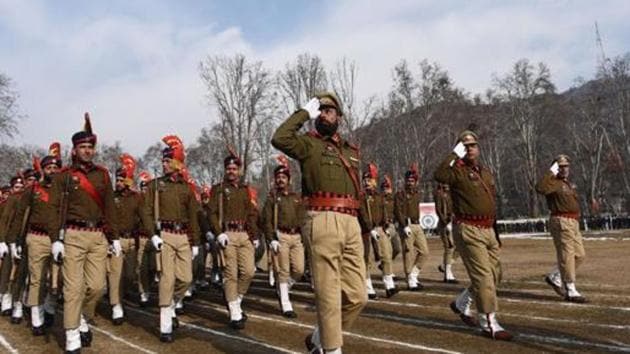 Jammu and Kashmir Police march past during full dress rehearsal for the Republic Day parade at Sher-e-Kashmir Stadium, in Srinagar. It has swept the bravery awards for police forces this year.(HT Photo)
