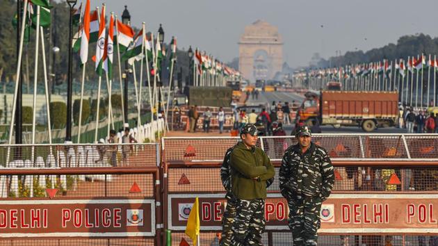 New Delhi: Security personnel stand guard at the Rajpath which is decked up for the Republic Day Parade, in New Delhi(PTI)