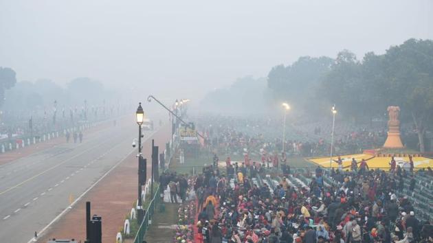 Huge crowd starts gathering to witness 71st Republic Day parade at Rajpath, New Delhi on Sunday.(Arvind Yadav/HT Photo)