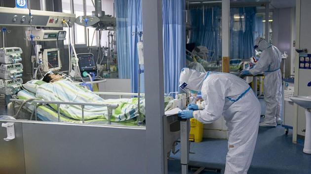 A medical worker attends to a patient in the intensive care unit at Zhongnan Hospital of Wuhan University in Wuhan in central China's Hubei Province.(AP File Photo) A medical worker attends to a patient in the intensive care unit at Zhongnan Hospital of Wuhan University in Wuhan in central China's Hubei Province.(AP File Photo)
