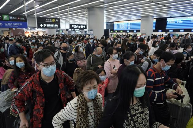 Passengers wear protective face masks at the departure hall of the high speed train station in Hong Kong. (Photo: AP) Passengers wear protective face masks at the departure hall of the high speed train station in Hong Kong. (Photo: AP)