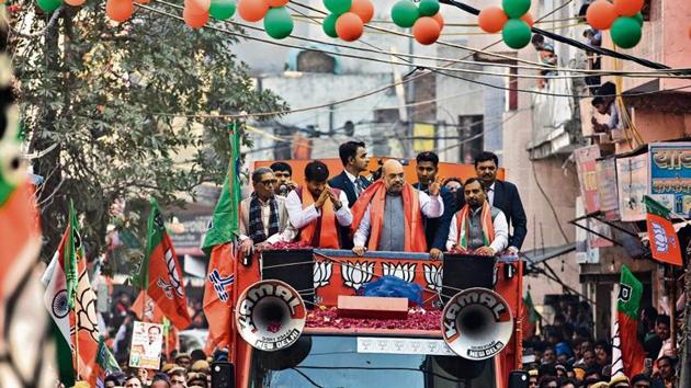 Home Minister Amit Shah accompanied by Manoj Tiwari during a road show ahead of Delhi assembly polls, at Ghonda in New Delhi, on Sunday, January 26, 2020.(Photo by Biplov Bhuyan/ Hindustan Times) Home Minister Amit Shah accompanied by Manoj Tiwari during a road show ahead of Delhi assembly polls, at Ghonda in New Delhi, on Sunday, January 26, 2020.(Photo by Biplov Bhuyan/ Hindustan Times)