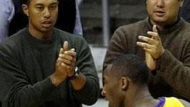 File photo of Tiger Woods cheering Kobe Bryant from the sidelines.(Twitter)