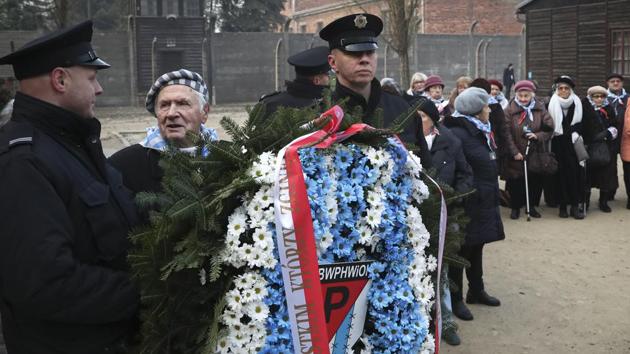 Survivors attend a wreath laying ceremony at the Auschwitz Nazi death camp in Oswiecim, Poland, Monday, Jan. 27, 2020. Survivors of the Auschwitz-Birkenau death camp gathered for commemorations marking the 75th anniversary of the Soviet army's liberation of the camp, using the testimony of survivors to warn about the signs of rising anti-Semitism and hatred in the world today.(AP Photo/Czarek Sokolowski)(AP) Survivors attend a wreath laying ceremony at the Auschwitz Nazi death camp in Oswiecim, Poland, Monday, Jan. 27, 2020. Survivors of the Auschwitz-Birkenau death camp gathered for commemorations marking the 75th anniversary of the Soviet army's liberation of the camp, using the testimony of survivors to warn about the signs of rising anti-Semitism and hatred in the world today.(AP Photo/Czarek Sokolowski)(AP)