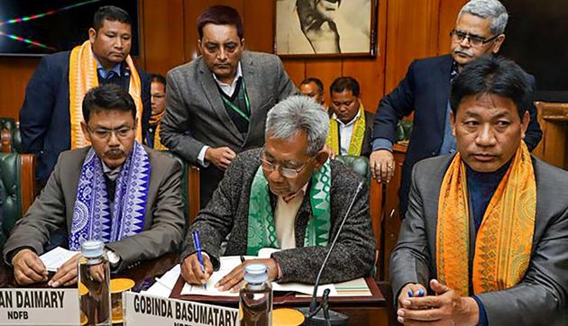 President of National Democratic Front of Boroland (NDFB) Govinda Basumatary (C) and President of the United Bodo People's Organization (UBPO) Mihiniswar Basumatary (R) sign an accord with the Centre and State government in New Delhi to facilitate all-round development of the Bodo areas, without compromising the territorial integrity of Assam.(PTI) President of National Democratic Front of Boroland (NDFB) Govinda Basumatary (C) and President of the United Bodo People's Organization (UBPO) Mihiniswar Basumatary (R) sign an accord with the Centre and State government in New Delhi to facilitate all-round development of the Bodo areas, without compromising the territorial integrity of Assam.(PTI)
