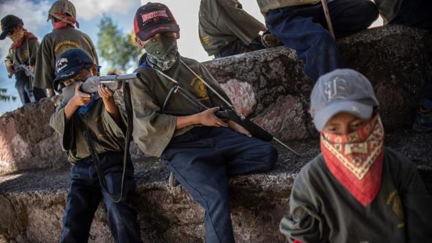 Guerrero is one of the poorest and most violent parts of Mexico, with one of the country’s highest murder rates because of drug gang wars over the trade in opium and marijuana. In the face of indifference from the authorities, 600 people voluntarily joined the militia force to fight organized crime. They included children. (Pedro PARDO / AFP) Guerrero is one of the poorest and most violent parts of Mexico, with one of the country’s highest murder rates because of drug gang wars over the trade in opium and marijuana. In the face of indifference from the authorities, 600 people voluntarily joined the militia force to fight organized crime. They included children. (Pedro PARDO / AFP)
