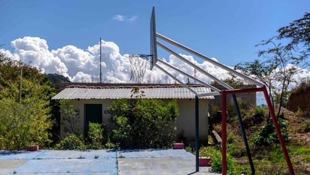 View of the yard of an abandoned school in the village of El Paraiso de Tepila. Inside are clothes, children’s shoes and bags of rotten corn cobs—everything left as it was when the occupants fled. (Pedro PARDO / AFP) View of the yard of an abandoned school in the village of El Paraiso de Tepila. Inside are clothes, children’s shoes and bags of rotten corn cobs—everything left as it was when the occupants fled. (Pedro PARDO / AFP)