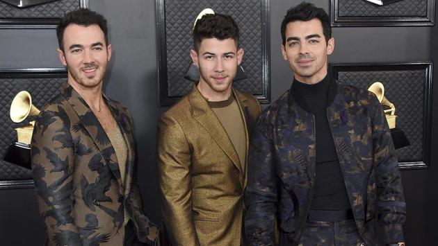 Kevin Jonas, from left, Nick Jonas and Joe Jonas, of the Jonas Brothers, arrive at the 62nd annual Grammy Awards at the Staples Center on Sunday, Jan. 26, 2020, in Los Angeles. (Photo by Jordan Strauss/Invision/AP) (Jordan Strauss/Invision/AP)