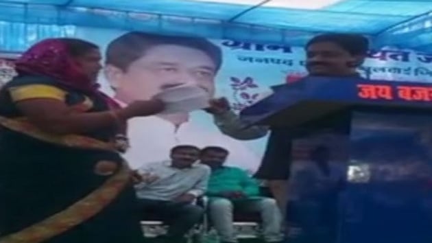 The minister heard out the woman and said that it takes time to implement schemes. (ANI Photo) The minister heard out the woman and said that it takes time to implement schemes. (ANI Photo)