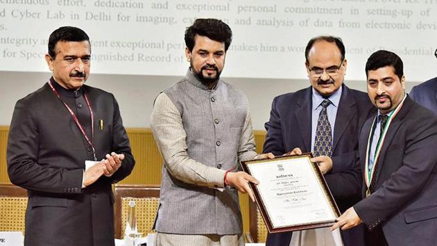 From left: CBIC chairman John Joseph, minister of state for finance and corporate affairs Anurag Thakur and revenue secretary Ajay Bhushan Pandey felicitate an awardee during the International Customs Day in New Delhi on Monday(Sanjeev Verma/HT PHOTO) From left: CBIC chairman John Joseph, minister of state for finance and corporate affairs Anurag Thakur and revenue secretary Ajay Bhushan Pandey felicitate an awardee during the International Customs Day in New Delhi on Monday(Sanjeev Verma/HT PHOTO)