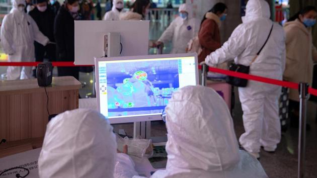 Workers in protective suits monitor a screen showing the thermal scan to check temperatures of passengers arriving at the Nanjing Railway Station, following the outbreak of a new coronavirus, during Chinese Lunar New Year holiday in Nanjing, China January 27, 2020. Picture taken January 27, 2020.(REUTERS) Workers in protective suits monitor a screen showing the thermal scan to check temperatures of passengers arriving at the Nanjing Railway Station, following the outbreak of a new coronavirus, during Chinese Lunar New Year holiday in Nanjing, China January 27, 2020. Picture taken January 27, 2020.(REUTERS)