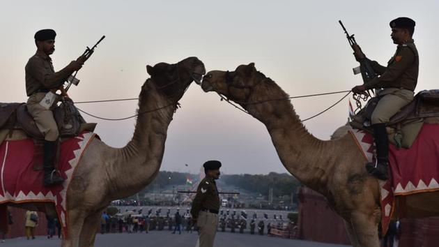 Border Security Force (BSF) camel contingent stands guard during the rehearsal. Train services at two metro stations near the India Gate will be curtailed on Wednesday in view of the Beating Retreat Ceremony, officials said on Monday. (Sanjeev Verma / HT Photo) Border Security Force (BSF) camel contingent stands guard during the rehearsal. Train services at two metro stations near the India Gate will be curtailed on Wednesday in view of the Beating Retreat Ceremony, officials said on Monday. (Sanjeev Verma / HT Photo)