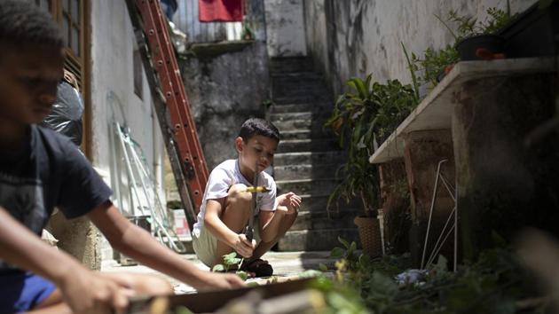The heat can be felt right from the morning, hotter still as Roque teaches preteens to compost in a home’s back patio. Why does she endure the labour and the heat? “I want to make the world green!” Roque said with a laugh, then collecting herself. “It’s because someone has to do it, truthfully that’s it. Someone has to do it.” (Silvia Izquierdo / AP) The heat can be felt right from the morning, hotter still as Roque teaches preteens to compost in a home’s back patio. Why does she endure the labour and the heat? “I want to make the world green!” Roque said with a laugh, then collecting herself. “It’s because someone has to do it, truthfully that’s it. Someone has to do it.” (Silvia Izquierdo / AP)