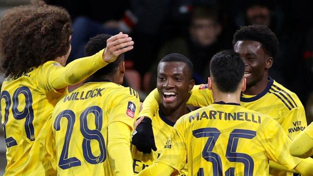 Arsenal's Eddie Nketiah celebrates scoring their second goal with teammates.(Action Images via Reuters)
