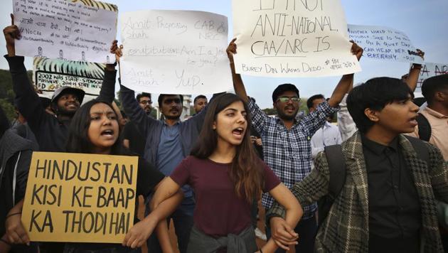 Students shout slogans and hold placards during a protest against the Citizenship Amendment Act in Bangalore, India.(AP) Students shout slogans and hold placards during a protest against the Citizenship Amendment Act in Bangalore, India.(AP)