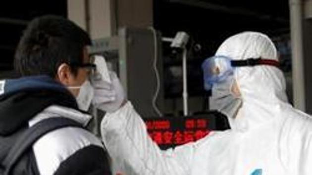 A worker in protective suit uses a thermometer to check the temperature of a man while he enters the Xizhimen subway station in China, as the country is hit by an outbreak of the new coronavirus, in Beijing, China January 27, 2020.(REUTERS) A worker in protective suit uses a thermometer to check the temperature of a man while he enters the Xizhimen subway station in China, as the country is hit by an outbreak of the new coronavirus, in Beijing, China January 27, 2020.(REUTERS)