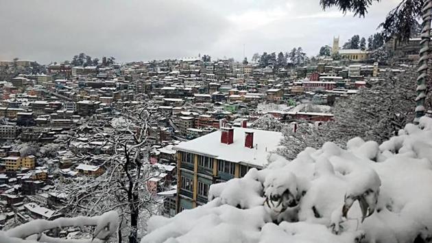 A picturesque view of Shimla town after fresh snowfall on Wednesday.(ANI Photo)