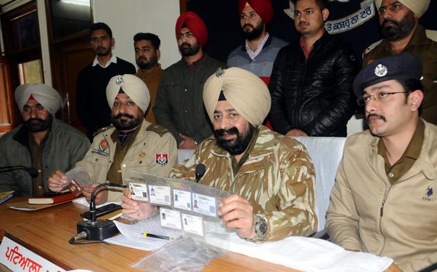 SSP Mandeep Singh Sidhu (right, sitting) interacting with the media at Police Lines in Patiala on Wednesday.(HT PHOTO)