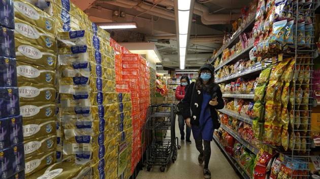 People wear face masks at a supermarket in Hong Kong on Wednesday. A viral outbreak that began in China has infected more than 6,000 people in the mainland and more than a dozen other countries.(AP Photo) People wear face masks at a supermarket in Hong Kong on Wednesday. A viral outbreak that began in China has infected more than 6,000 people in the mainland and more than a dozen other countries.(AP Photo)