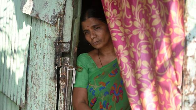 Saroj Ahire stands at the entrance to her house as she speaks with AFP in the Colaba fisherman colony. “Watching them enjoy good food while I clean their homes... it causes a bit of heartburn for sure,” she said. “We also want to live a good life and eat well.” (Punit Paranjpe / AFP) Saroj Ahire stands at the entrance to her house as she speaks with AFP in the Colaba fisherman colony. “Watching them enjoy good food while I clean their homes... it causes a bit of heartburn for sure,” she said. “We also want to live a good life and eat well.” (Punit Paranjpe / AFP)