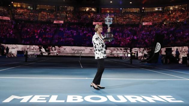 Margaret Court holds up the women's Australian Open trophy.(AP)