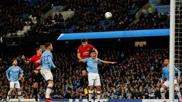 Manchester United's Harry Maguire heads at goal(REUTERS)