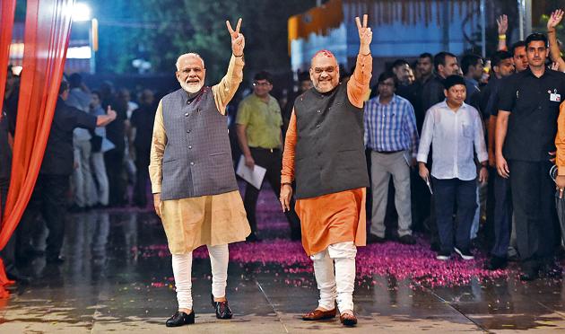 PM Narendra Modi and current Minister of Home Affairs, Amit Shah, in New Delhi on May 23, 2019, celebrating the BJP’s victory in the 2019 general elections.(Money Sharma/AFP) PM Narendra Modi and current Minister of Home Affairs, Amit Shah, in New Delhi on May 23, 2019, celebrating the BJP’s victory in the 2019 general elections.(Money Sharma/AFP)
