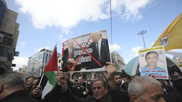 Palestinians protest the Mideast plan announced by the U.S. President Donald Trump, in Hebron, West Bank. Trump's Mideast plan would create a disjointed Palestinian state with a capital on the outskirts of east Jerusalem.(AP) Palestinians protest the Mideast plan announced by the U.S. President Donald Trump, in Hebron, West Bank. Trump's Mideast plan would create a disjointed Palestinian state with a capital on the outskirts of east Jerusalem.(AP)