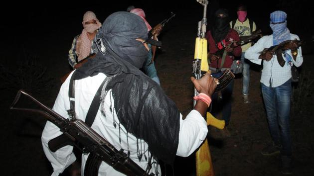 People's Liberation Front of India (PLFI) head Dinesh Gope ( back to camera) platoon showing their latest firearms in the forest at undisclosed location near Jharkhand -Odisha border. His wives were arrested by NIA on Thursday.(Hindustan Times Photo/File) People's Liberation Front of India (PLFI) head Dinesh Gope ( back to camera) platoon showing their latest firearms in the forest at undisclosed location near Jharkhand -Odisha border. His wives were arrested by NIA on Thursday.(Hindustan Times Photo/File)