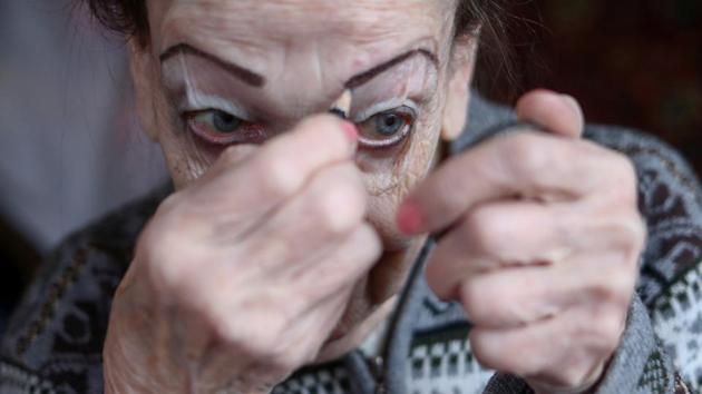 Maya Kachina applies make-up at her home in Moscow. With wardrobes full of sparkling costumes and cabinets packed with trophies, dancing has given the pair a new life. “I’m terribly fond of giving performances. I’m terribly happy,” Kachina said after one of her many dance shows. (Evgenia Novozhenina / REUTERS) Maya Kachina applies make-up at her home in Moscow. With wardrobes full of sparkling costumes and cabinets packed with trophies, dancing has given the pair a new life. “I’m terribly fond of giving performances. I’m terribly happy,” Kachina said after one of her many dance shows. (Evgenia Novozhenina / REUTERS)