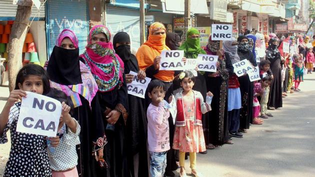 Muslim women activists form a human chain as they protest during Bharat Bandh called by Bahujan Kranti Morcha against CAA and NRC, in Bhopal on Wednesday. (ANI Photo) Muslim women activists form a human chain as they protest during Bharat Bandh called by Bahujan Kranti Morcha against CAA and NRC, in Bhopal on Wednesday. (ANI Photo)