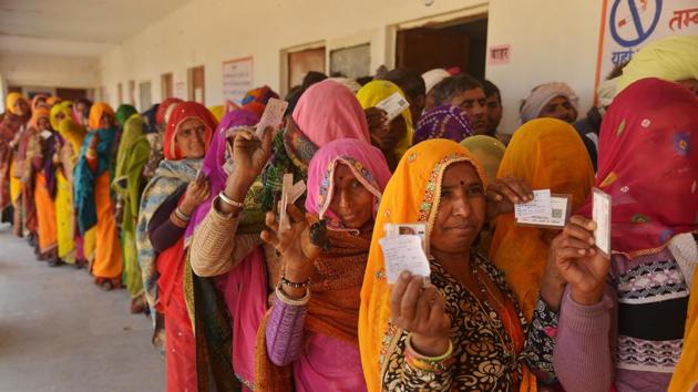 Women stand in a queue to cast vote during the panchayat elections at a polling station in Ajmer, Rajasthan on January 17.(PTI) Women stand in a queue to cast vote during the panchayat elections at a polling station in Ajmer, Rajasthan on January 17.(PTI)