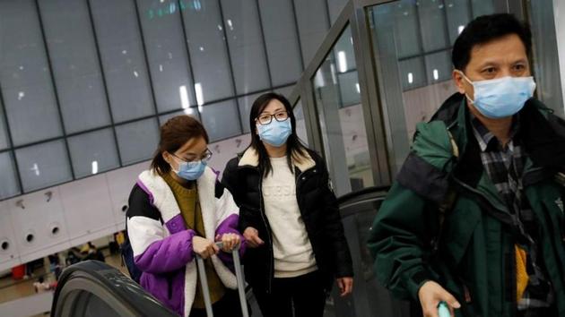 Passengers wear masks at Hong Kong West Kowloon High Speed Train Station Terminus(REUTERS)