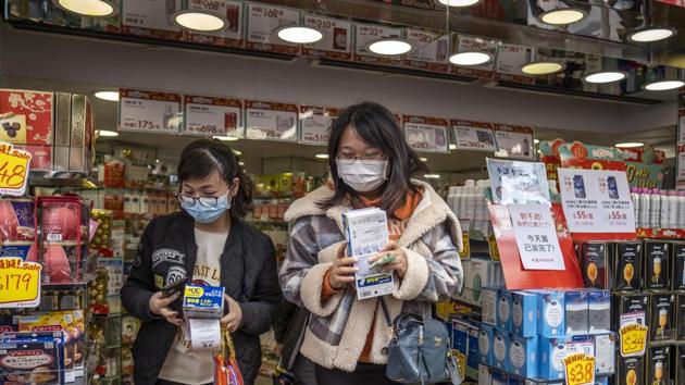 Customers leave with boxes of newly purchased protective masks at a Bonjour Holdings Ltd. store in Hong Kong, China.(Bloomberg) Customers leave with boxes of newly purchased protective masks at a Bonjour Holdings Ltd. store in Hong Kong, China.(Bloomberg)