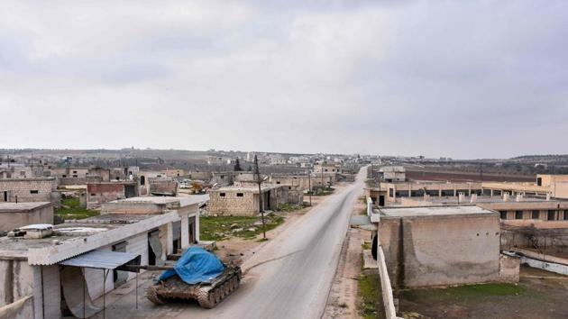 A tank is seen covered with a plastic sheet on the road between the villages of Deir Sharqi and Talmans on the eastern outskirts of Maaret al-Numan. In August, Syrian troops captured another town along the highway, Khan Sheikhoun. Now that Syrian troops are in control of Maaret al-Numan, their next target is likely to be Saraqeb, which would become the last major town on the M5 highway that remains outside government control. (SANA / AFP) A tank is seen covered with a plastic sheet on the road between the villages of Deir Sharqi and Talmans on the eastern outskirts of Maaret al-Numan. In August, Syrian troops captured another town along the highway, Khan Sheikhoun. Now that Syrian troops are in control of Maaret al-Numan, their next target is likely to be Saraqeb, which would become the last major town on the M5 highway that remains outside government control. (SANA / AFP)