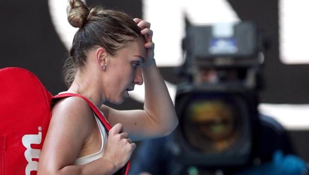 Romania's Simona Halep walks off court after losing her match against Spain's Garbine Muguruza.(REUTERS) Romania's Simona Halep walks off court after losing her match against Spain's Garbine Muguruza.(REUTERS)