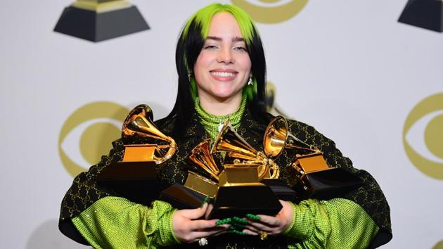 US singer-songwriter Billie Eilish poses in the press room with the awards for Album Of The Year, Record Of The Year, Best New Artist, Song Of The Year and Best Pop Vocal Album during the 62nd Annual Grammy Awards, in Los Angeles, California. (Frederic J. Brown / AFP) US singer-songwriter Billie Eilish poses in the press room with the awards for Album Of The Year, Record Of The Year, Best New Artist, Song Of The Year and Best Pop Vocal Album during the 62nd Annual Grammy Awards, in Los Angeles, California. (Frederic J. Brown / AFP)