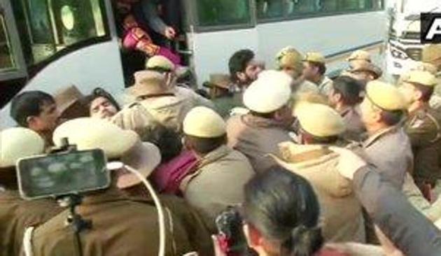 Protesters who were sitting outside Police Headquarters(old) at ITO against the firing incident in Jamia area yesterday, detained by Police, according to ANI. (ANI Photo) Protesters who were sitting outside Police Headquarters(old) at ITO against the firing incident in Jamia area yesterday, detained by Police, according to ANI. (ANI Photo)