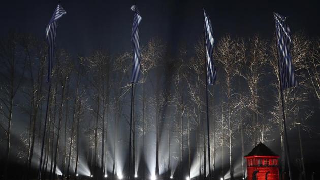Flags with the stripes of the prison uniforms of Nazi death camps fly at the fence of Birkenau at the Auschwitz Nazi death camp in Oswiecim, Poland. Survivors of the death camp gathered for commemorations marking the 75th anniversary of the Soviet army’s liberation of the camp, using the testimony of survivors to warn about the signs of rising anti-Semitism and hatred. (Czarek Sokolowski / AP) Flags with the stripes of the prison uniforms of Nazi death camps fly at the fence of Birkenau at the Auschwitz Nazi death camp in Oswiecim, Poland. Survivors of the death camp gathered for commemorations marking the 75th anniversary of the Soviet army’s liberation of the camp, using the testimony of survivors to warn about the signs of rising anti-Semitism and hatred. (Czarek Sokolowski / AP)