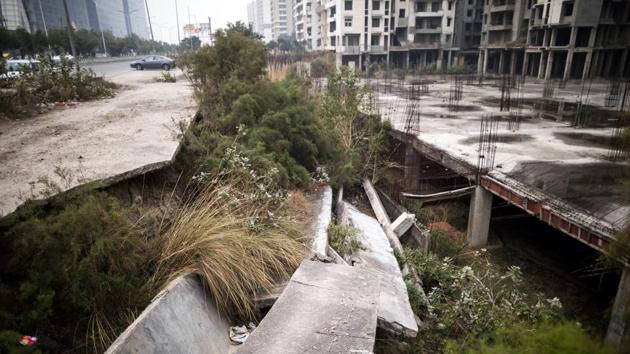 A collapsed sidewalk at Shubhkamna Techomes in Noida. Wish Town’s failure and the larger real estate market illustrate the extent of the economy’s woes. Wish Town’s Jaypee Infratech Ltd. have gone bust, are mired debt and unable to secure funding to complete projects. Non-bank financing, the lifeline for millions of small businesses and consumers in recent years, has dried up. (Prashanth Vishwanathan / Bloomberg) A collapsed sidewalk at Shubhkamna Techomes in Noida. Wish Town’s failure and the larger real estate market illustrate the extent of the economy’s woes. Wish Town’s Jaypee Infratech Ltd. have gone bust, are mired debt and unable to secure funding to complete projects. Non-bank financing, the lifeline for millions of small businesses and consumers in recent years, has dried up. (Prashanth Vishwanathan / Bloomberg)
