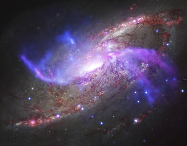 The galaxy NGC 4258, also known as M106, about 23 million light-years away from Earth was captured by the NASA's Chandra X-ray Observatory, the National Science Foundation's Karl Jansky Very Large Array, the Hubble Space Telescope and the Spitzer Space Telescope. NASA has decommissioned the Spitzer Space Telescope, one of its greatest observatories which has studied the universe by detecting cosmic infrared radiation for more than 16 years, the US space agency said in a statement. (AP) The galaxy NGC 4258, also known as M106, about 23 million light-years away from Earth was captured by the NASA's Chandra X-ray Observatory, the National Science Foundation's Karl Jansky Very Large Array, the Hubble Space Telescope and the Spitzer Space Telescope. NASA has decommissioned the Spitzer Space Telescope, one of its greatest observatories which has studied the universe by detecting cosmic infrared radiation for more than 16 years, the US space agency said in a statement. (AP)