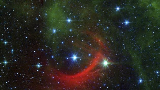 The runaway star Kappa Cassiopeiae, or HD 2905 and its bow shock formed when the magnetic fields and wind of particles flowing off the star collide with the diffuse, and usually invisible, gas and dust that fill the space between stars as it travels. It was captured by the Spitzer Space Telescope. (NASA/JPL-Caltech/AP) The runaway star Kappa Cassiopeiae, or HD 2905 and its bow shock formed when the magnetic fields and wind of particles flowing off the star collide with the diffuse, and usually invisible, gas and dust that fill the space between stars as it travels. It was captured by the Spitzer Space Telescope. (NASA/JPL-Caltech/AP)