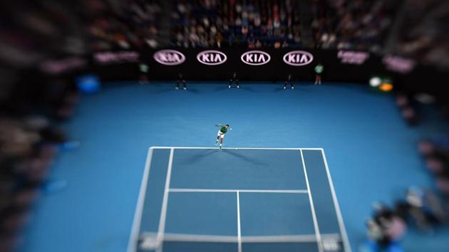 This picture taken with a tilt-shift lens shows Serbia’s Novak Djokovic serve against Canada’s Milos Raonic during their men’s singles quarter-final match on day nine of the Australian Open tennis tournament in Melbourne, Australia. (Manan Vatsyayana / AFP) This picture taken with a tilt-shift lens shows Serbia’s Novak Djokovic serve against Canada’s Milos Raonic during their men’s singles quarter-final match on day nine of the Australian Open tennis tournament in Melbourne, Australia. (Manan Vatsyayana / AFP)