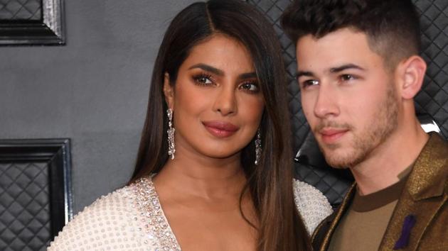 Priyanka Chopra poses with US singer-songwriter and husband Nick Jonas at the 62nd Annual Grammy Awards on January 26.(AFP)