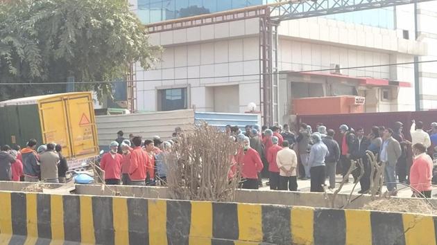 People gathered outside as rescue operations continue outside Haldiram building in Noida. (@SinghAmis0777/Twitter) People gathered outside as rescue operations continue outside Haldiram building in Noida. (@SinghAmis0777/Twitter)