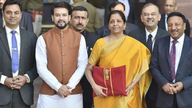 Finance Minister Nirmala Sitharaman holding the Budget folder along with Minister of State in the Ministry of Finance Anurag Thakur and other senior officials. (Photo by Ajay Aggarwal/ Hindustan Times) Finance Minister Nirmala Sitharaman holding the Budget folder along with Minister of State in the Ministry of Finance Anurag Thakur and other senior officials. (Photo by Ajay Aggarwal/ Hindustan Times)