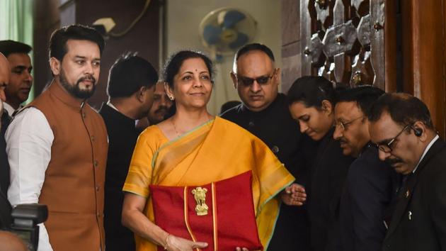 Union Finance Minister Nirmala Sitharaman, flanked by her deputy Anurag Thakur (to her right) and a team of officials, shows a folder containing the Union Budget documents at Parliament in New Delhi. (Photo: PTI) Union Finance Minister Nirmala Sitharaman, flanked by her deputy Anurag Thakur (to her right) and a team of officials, shows a folder containing the Union Budget documents at Parliament in New Delhi. (Photo: PTI)