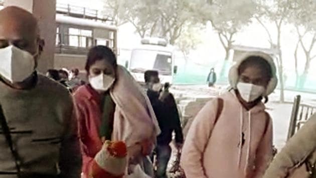 Indian passengers who were brought back by special Air India flight from coronavirus-hit Wuhan wear medical mask at the Indo-Tibetan Border Police (ITBP) medical observation camp, in New Delhi on Saturday.(ANI Photo)