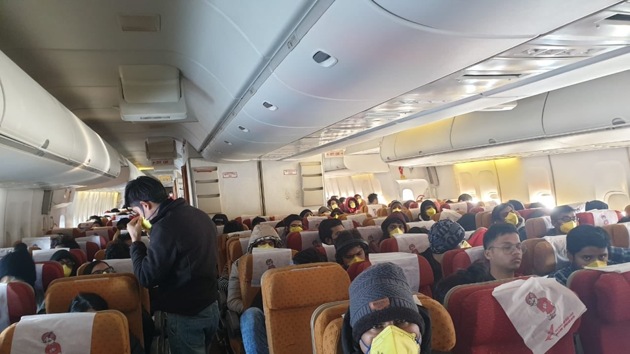 Indians on board the Air India aircraft which evacuated them from Wuhan in China on Sunday. (HT Photo) Indians on board the Air India aircraft which evacuated them from Wuhan in China on Sunday. (HT Photo)
