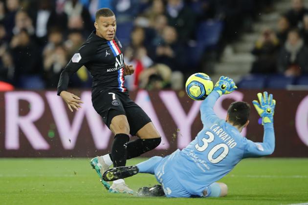 PSG's Kylian Mbappe, left,, scores a goal against Montpellier. (AP) PSG's Kylian Mbappe, left,, scores a goal against Montpellier. (AP)